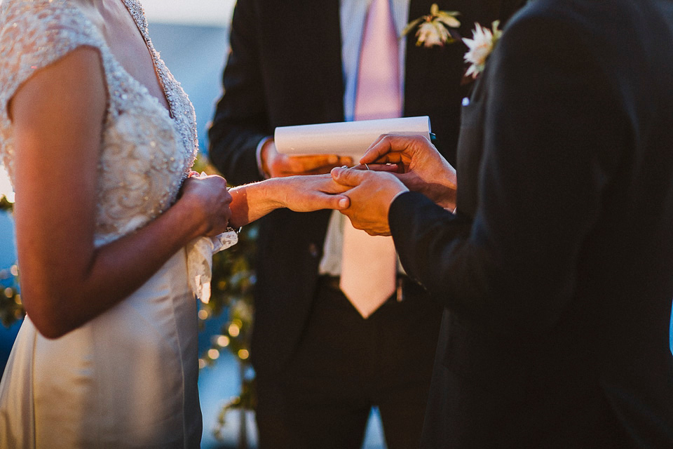 The bride wears Mori Lee for her glamorous rooftop New York wedding. Photography by Forged In The North