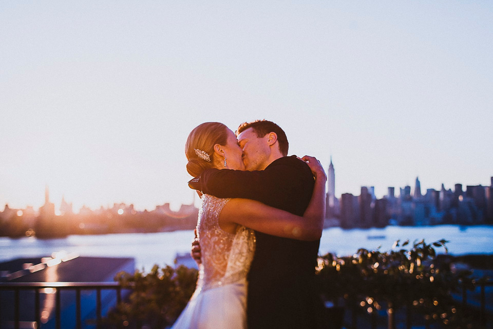 The bride wears Mori Lee for her glamorous rooftop New York wedding. Photography by Forged In The North