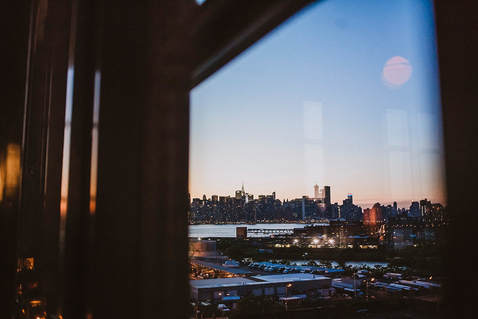 The bride wears Mori Lee for her glamorous rooftop New York wedding. Photography by Forged In The North