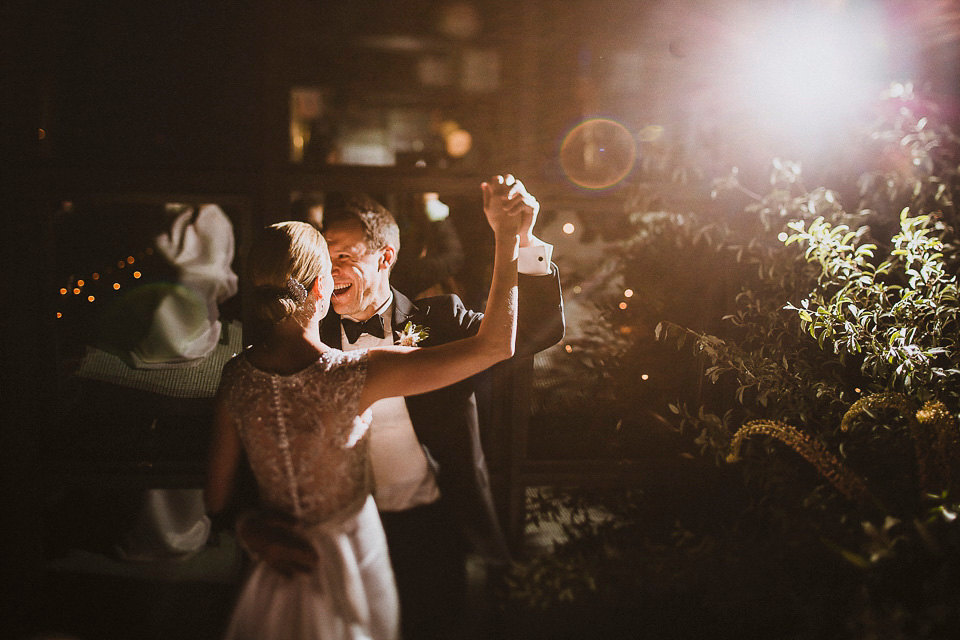 The bride wears Mori Lee for her glamorous rooftop New York wedding. Photography by Forged In The North