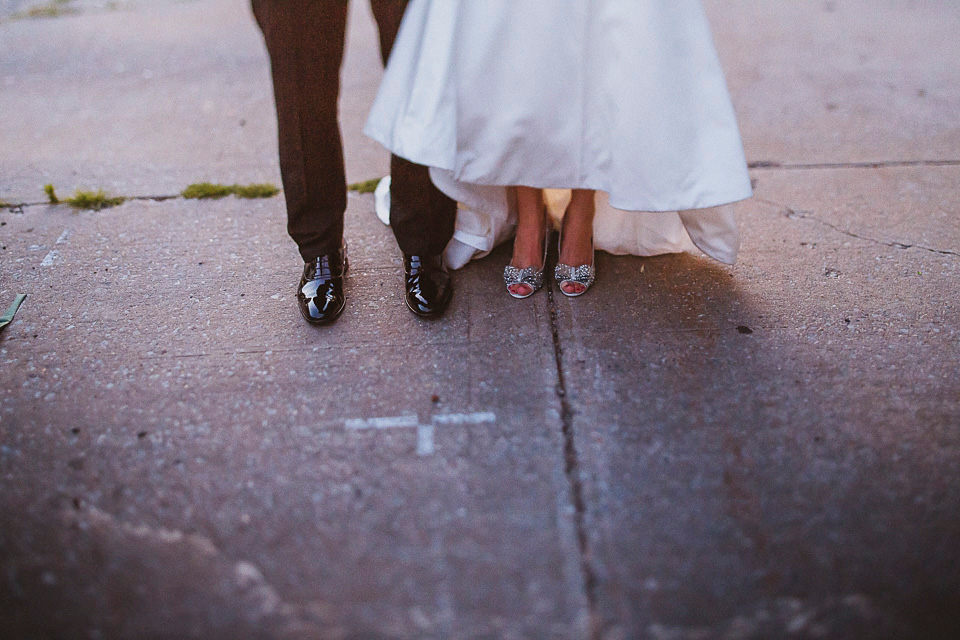 The bride wears Mori Lee for her glamorous rooftop New York wedding. Photography by Forged In The North