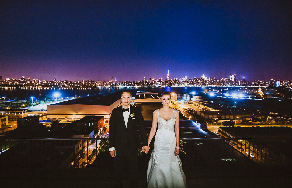 The bride wears Mori Lee for her glamorous rooftop New York wedding. Photography by Forged In The North