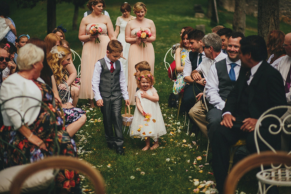 The bride wears Grace Loves Lace for her laid back, rustic, simple and elegant outdoor wedding in the Italian hillsides. Photography by Peter Jurica, film by Happy Wedding Films.