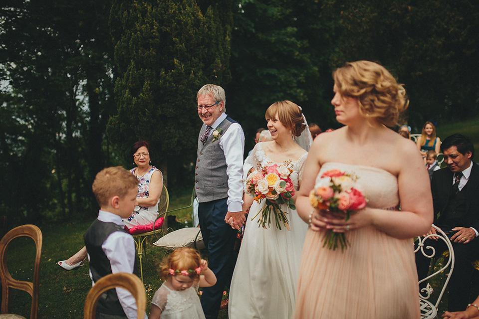 The bride wears Grace Loves Lace for her laid back, rustic, simple and elegant outdoor wedding in the Italian hillsides. Photography by Peter Jurica, film by Happy Wedding Films.