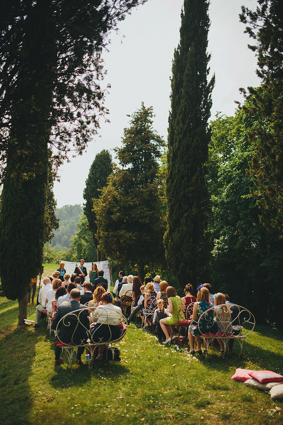 The bride wears Grace Loves Lace for her laid back, rustic, simple and elegant outdoor wedding in the Italian hillsides. Photography by Peter Jurica, film by Happy Wedding Films.