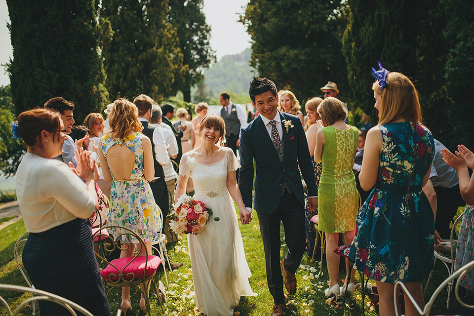 The bride wears Grace Loves Lace for her laid back, rustic, simple and elegant outdoor wedding in the Italian hillsides. Photography by Peter Jurica, film by Happy Wedding Films.