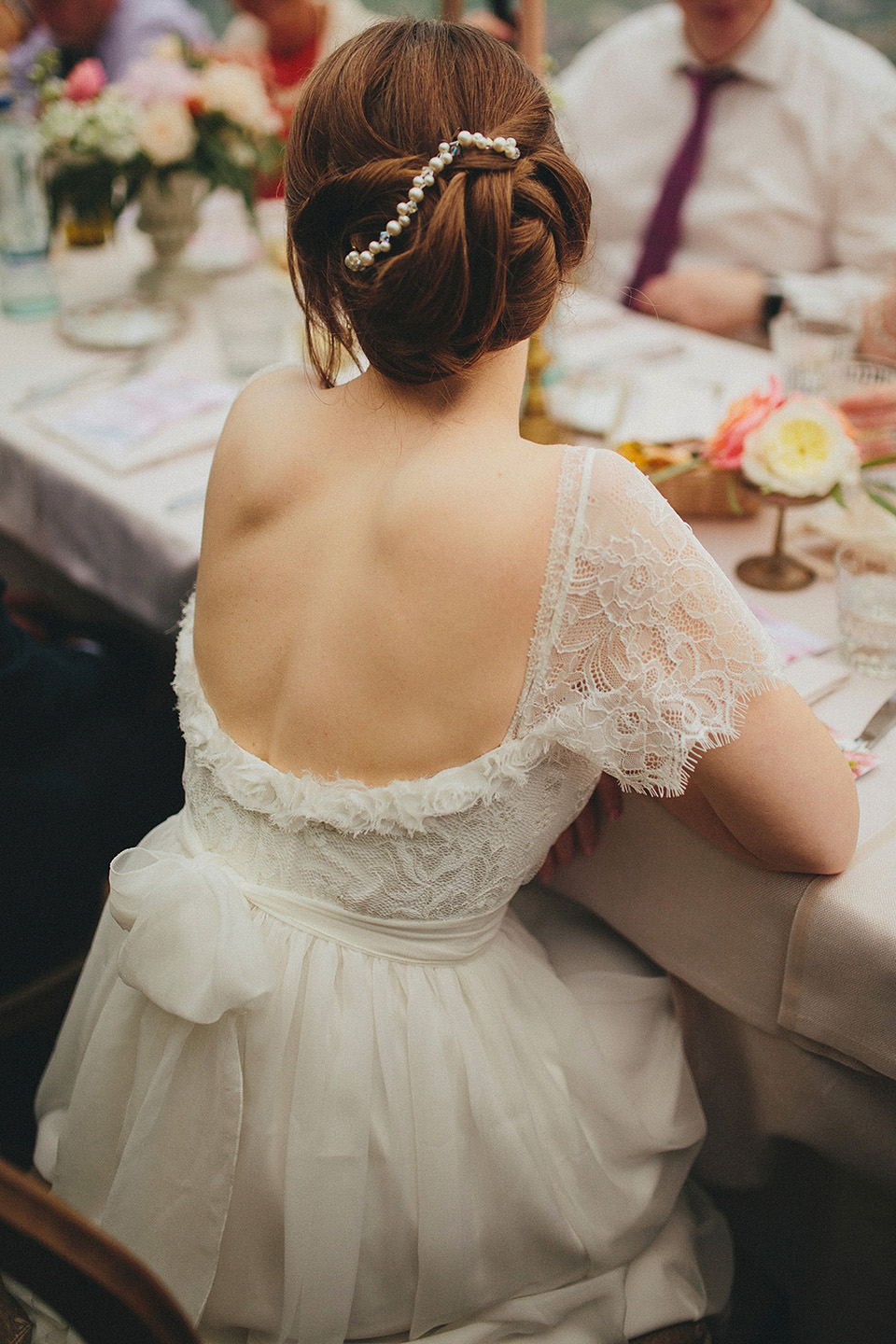 The bride wears Grace Loves Lace for her laid back, rustic, simple and elegant outdoor wedding in the Italian hillsides. Photography by Peter Jurica, film by Happy Wedding Films.