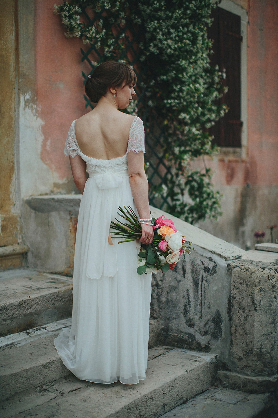 The bride wears Grace Loves Lace for her laid back, rustic, simple and elegant outdoor wedding in the Italian hillsides. Photography by Peter Jurica, film by Happy Wedding Films.