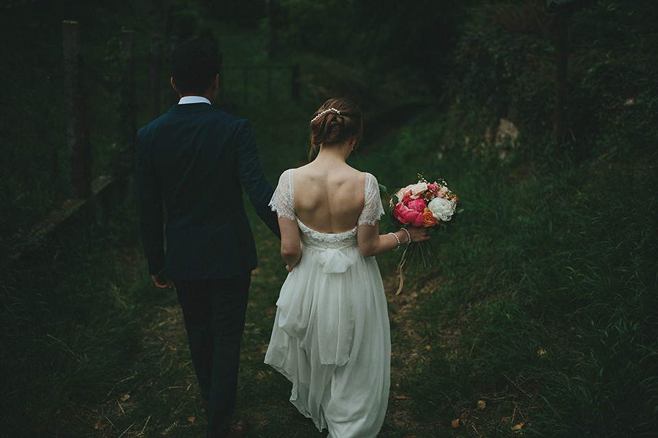 The bride wears Grace Loves Lace for her laid back, rustic, simple and elegant outdoor wedding in the Italian hillsides. Photography by Peter Jurica, film by Happy Wedding Films.