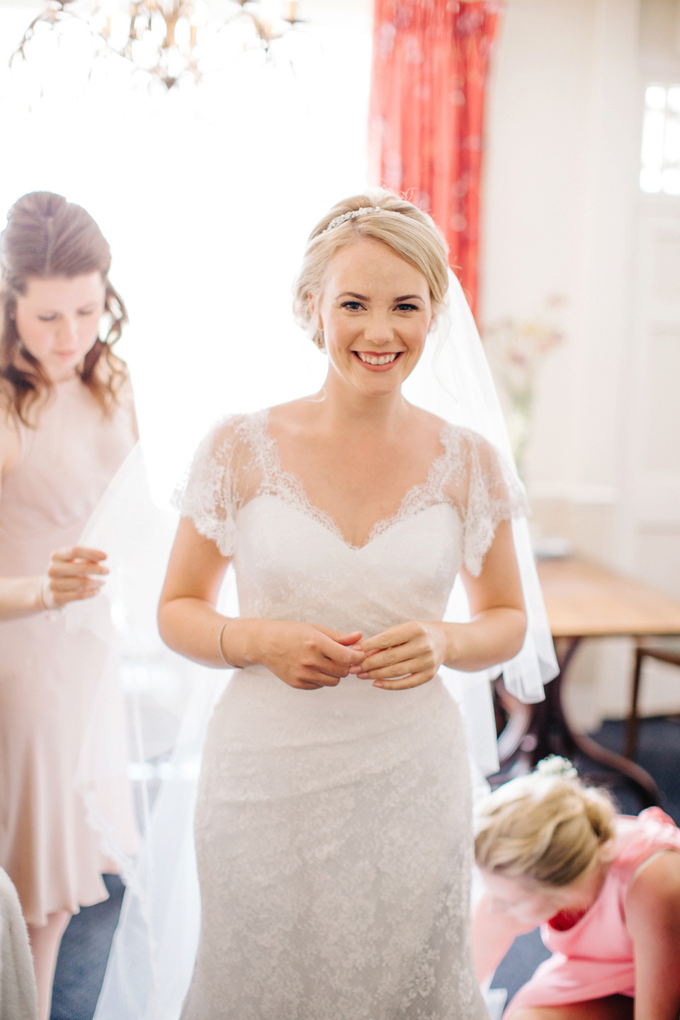 The bride wears Suzanne Neville for her Summer wedding at a vintage railway station. Images by M&J Photography.