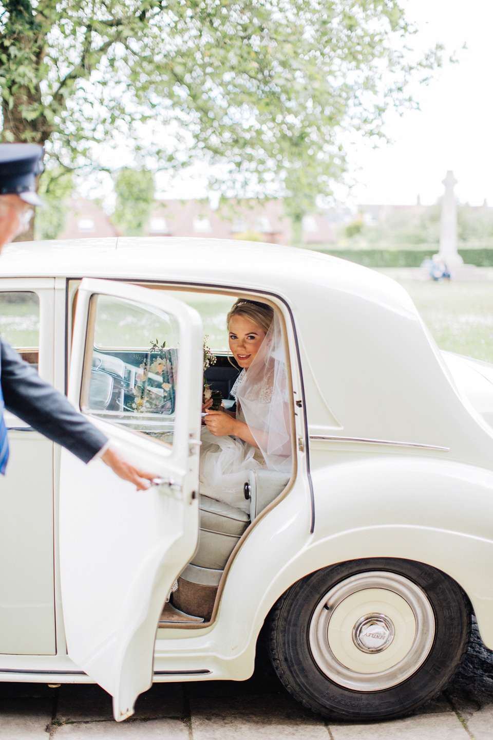 The bride wears Suzanne Neville for her Summer wedding at a vintage railway station. Images by M&J Photography.