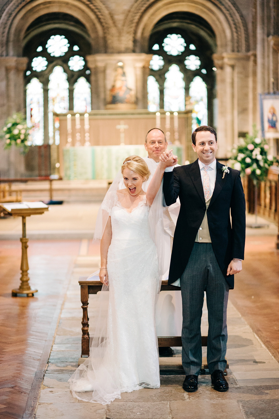 The bride wears Suzanne Neville for her Summer wedding at a vintage railway station. Images by M&J Photography.