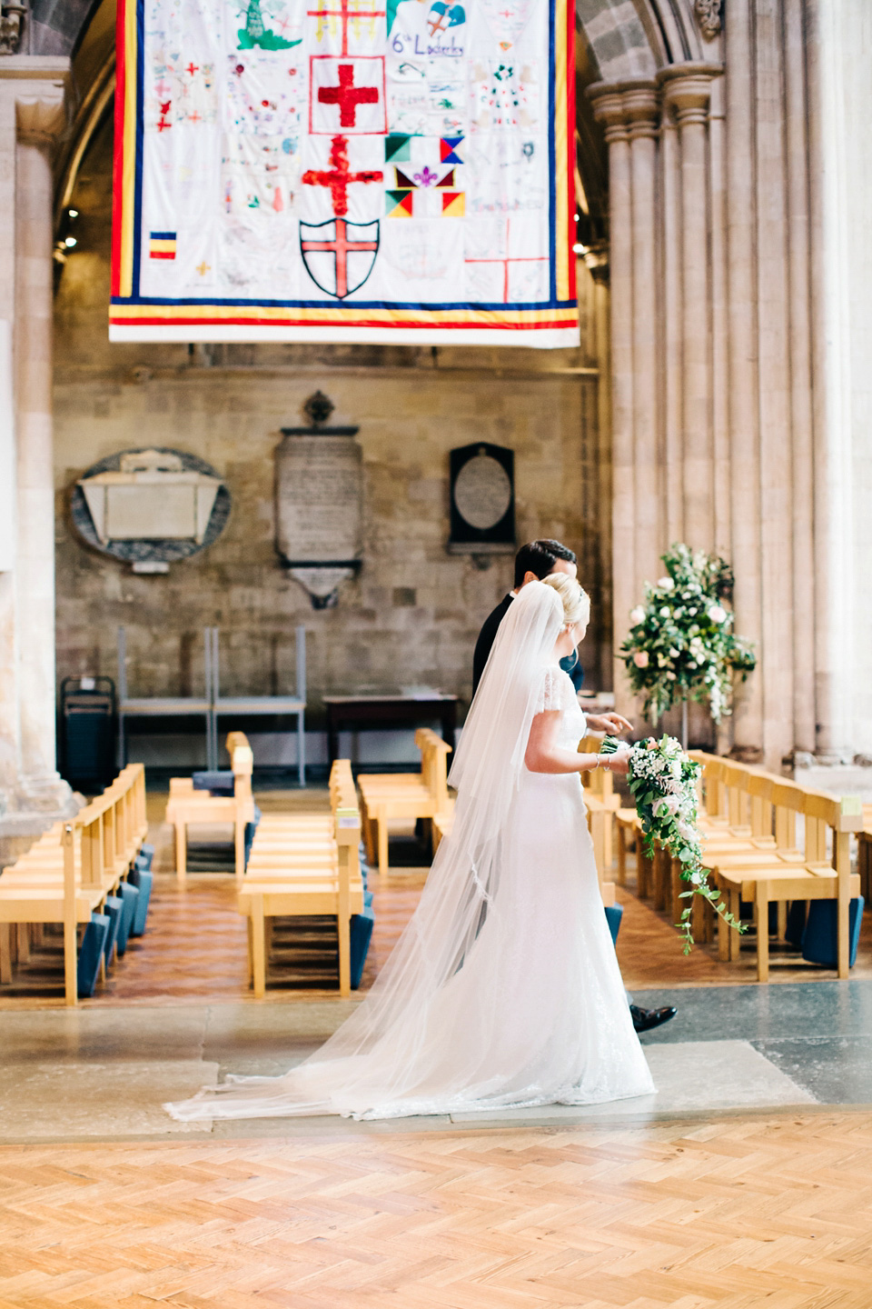 The bride wears Suzanne Neville for her Summer wedding at a vintage railway station. Images by M&J Photography.