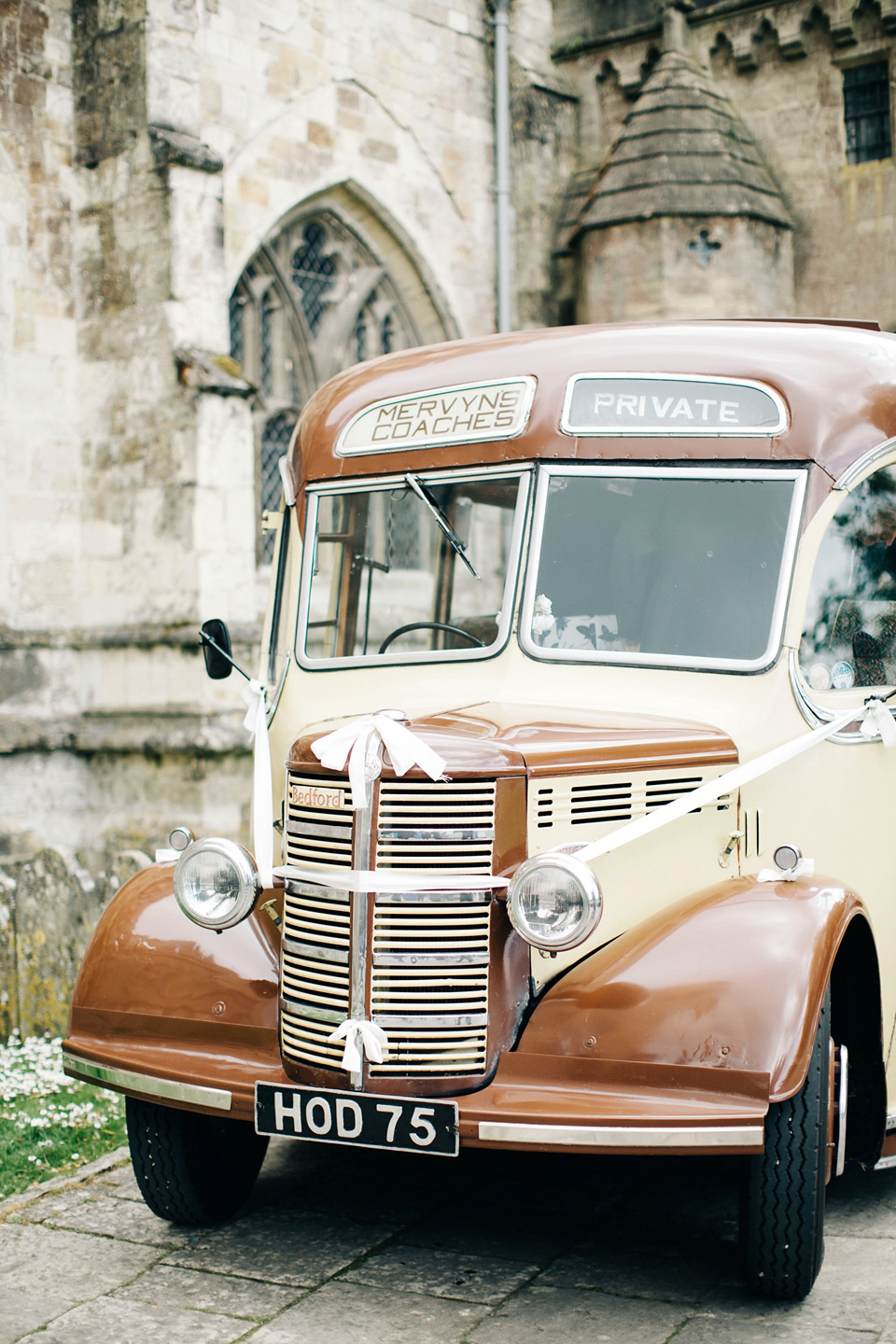 The bride wears Suzanne Neville for her Summer wedding at a vintage railway station. Images by M&J Photography.