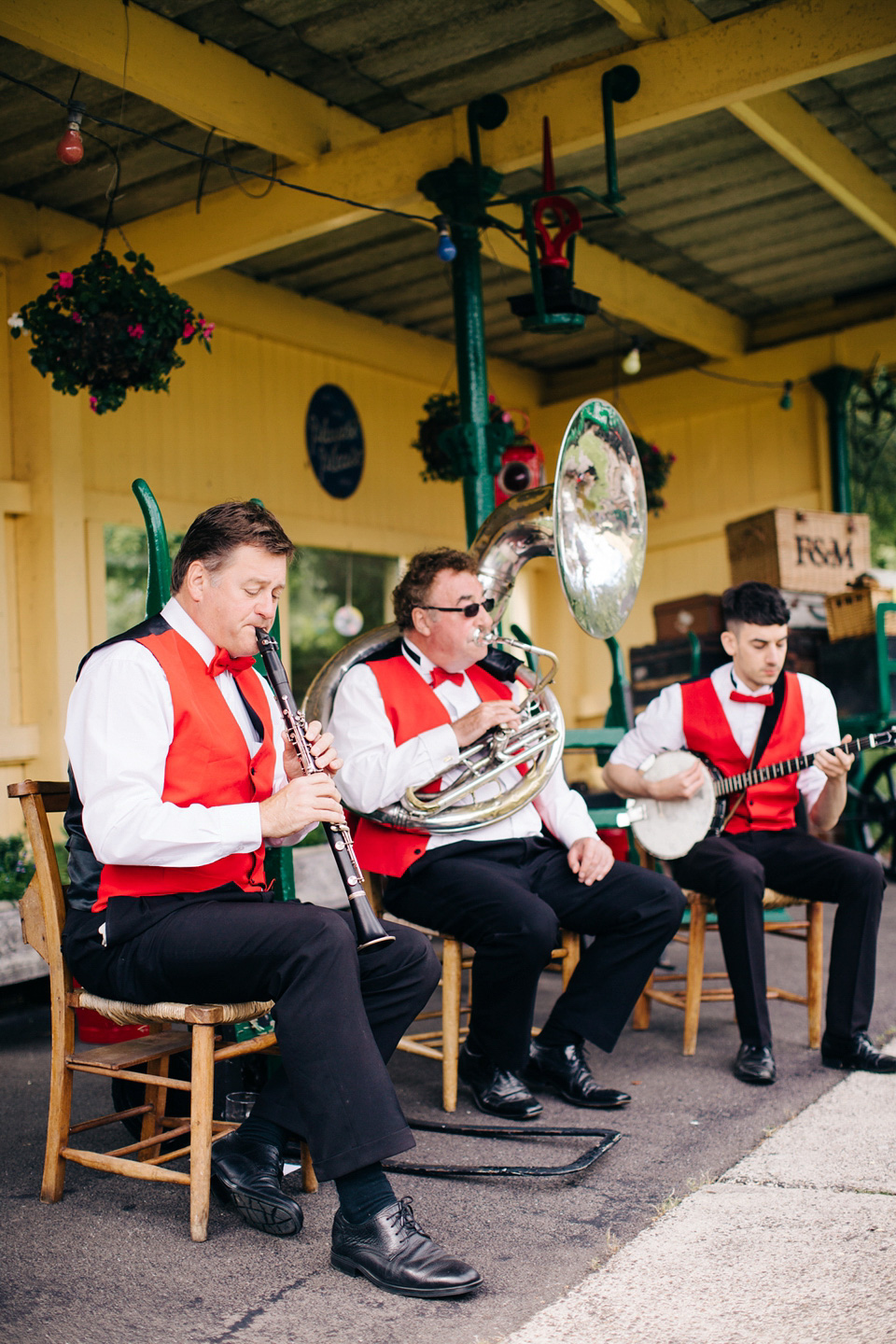 The bride wears Suzanne Neville for her Summer wedding at a vintage railway station. Images by M&J Photography.