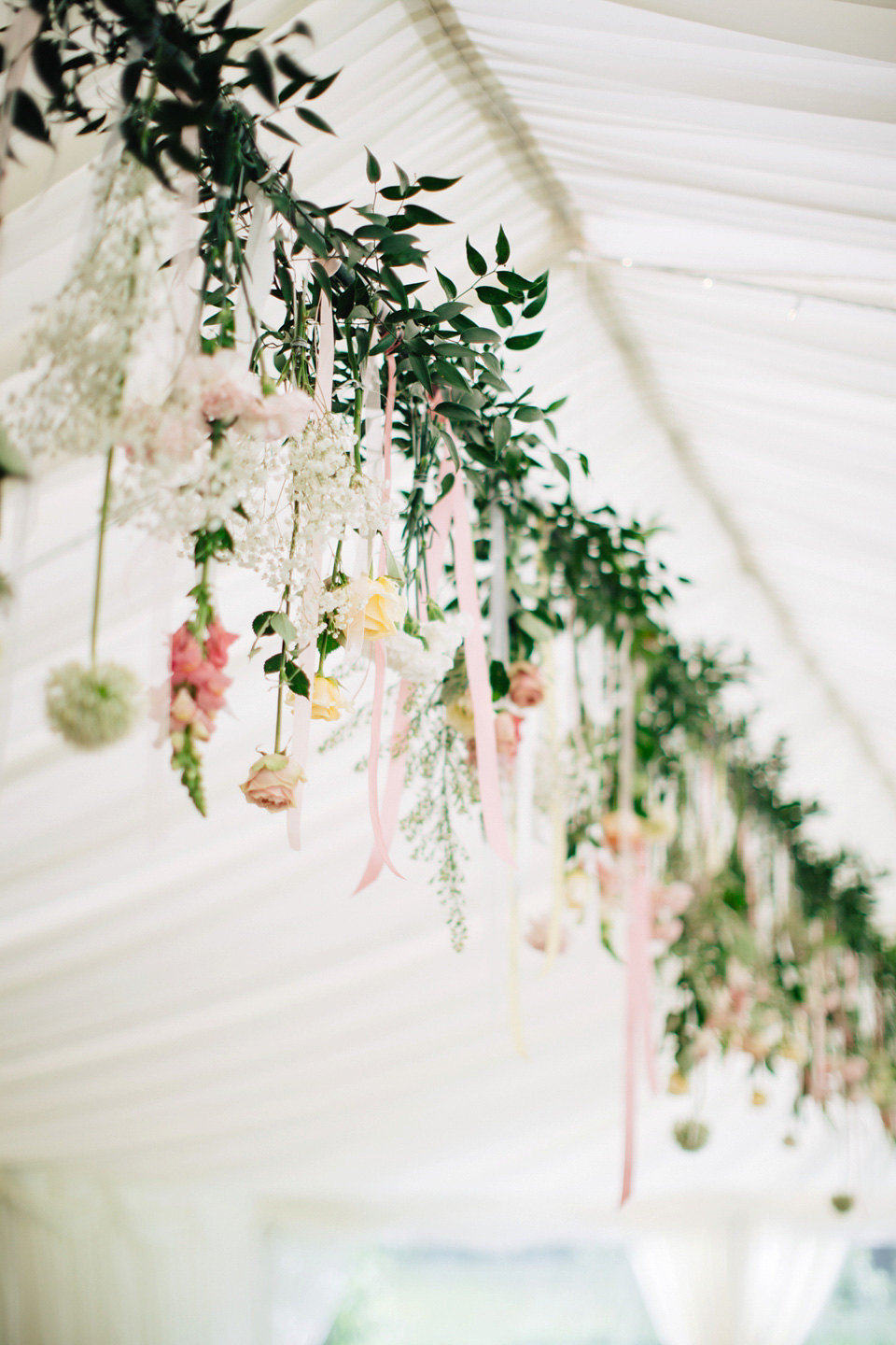 The bride wears Suzanne Neville for her Summer wedding at a vintage railway station. Images by M&J Photography.