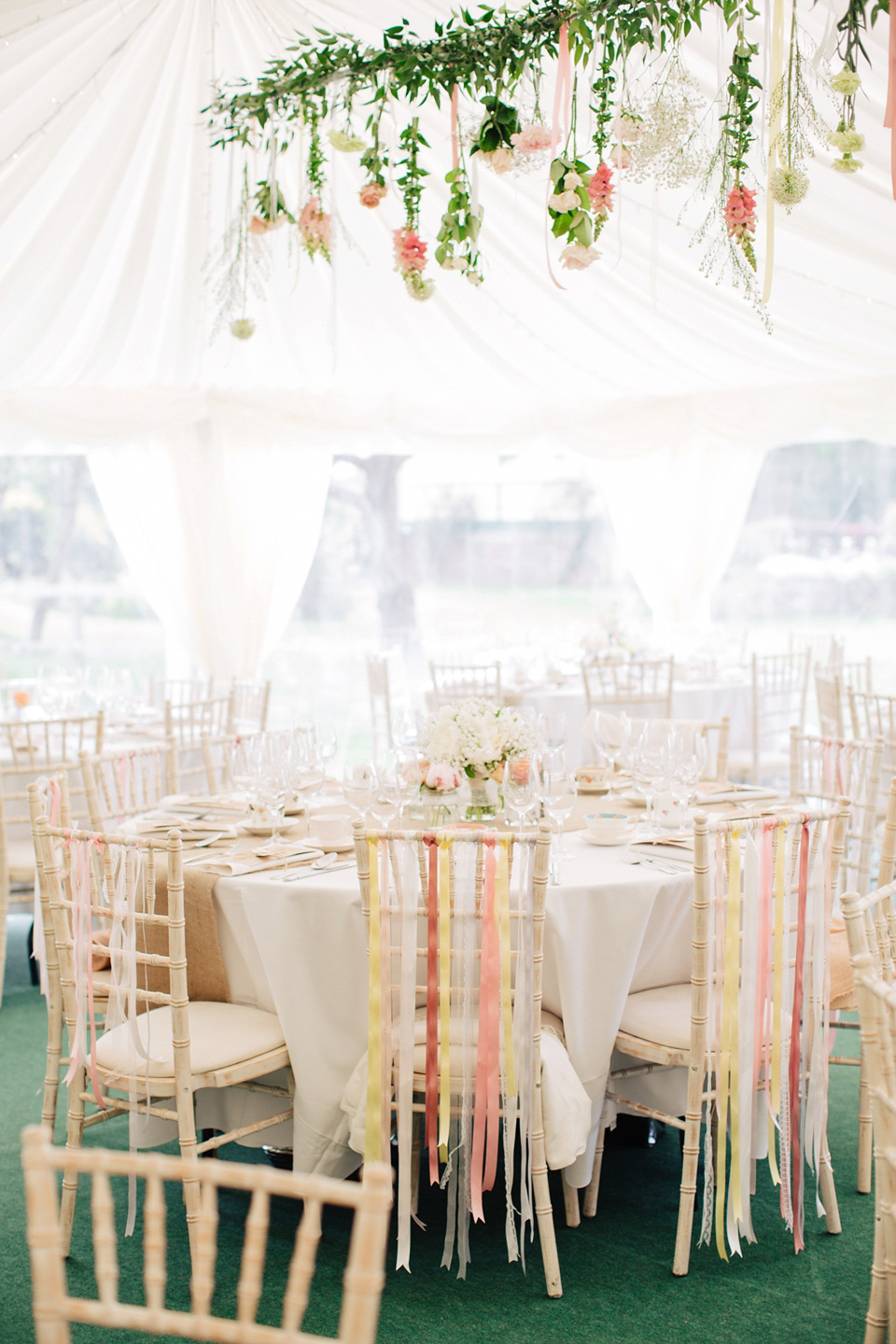 The bride wears Suzanne Neville for her Summer wedding at a vintage railway station. Images by M&J Photography.