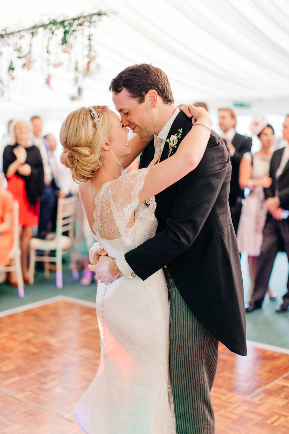 The bride wears Suzanne Neville for her Summer wedding at a vintage railway station. Images by M&J Photography.