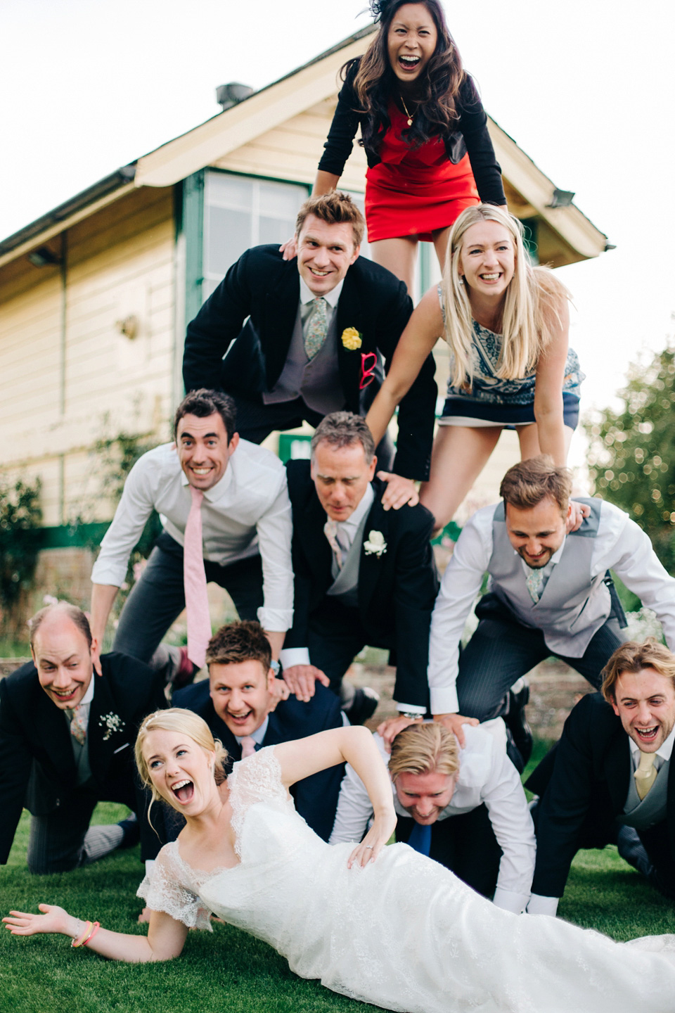 The bride wears Suzanne Neville for her Summer wedding at a vintage railway station. Images by M&J Photography.