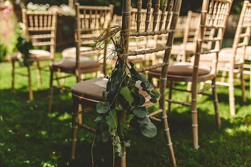 The bride wore a Watters wedding dress for her wedding at The Great Barn at Micklefield Hall in Hertfordshire. The bridesmaids wore navy blue. Photography by Benjamin Stuart.