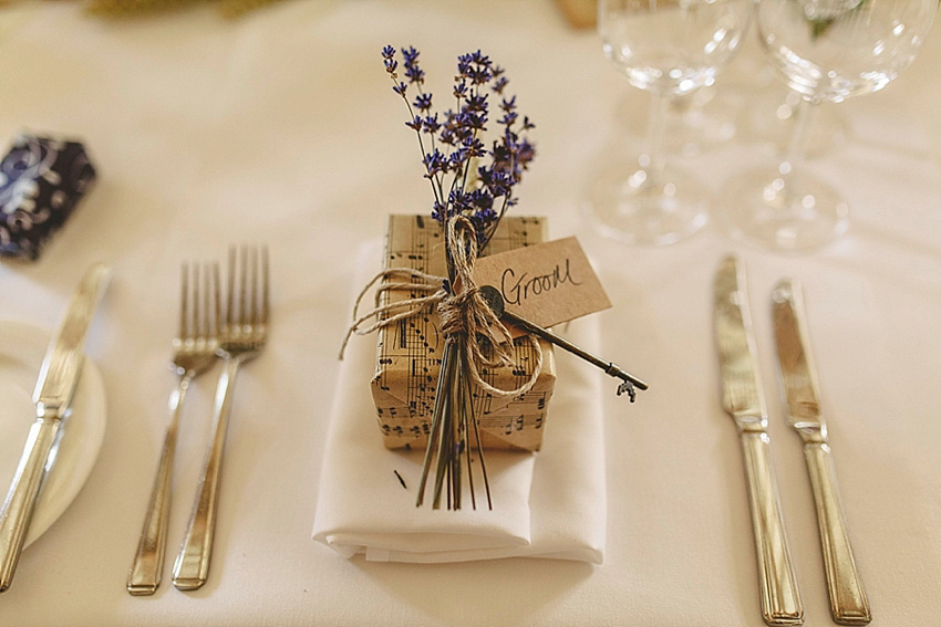 The bride wore a Watters wedding dress for her wedding at The Great Barn at Micklefield Hall in Hertfordshire. The bridesmaids wore navy blue. Photography by Benjamin Stuart.