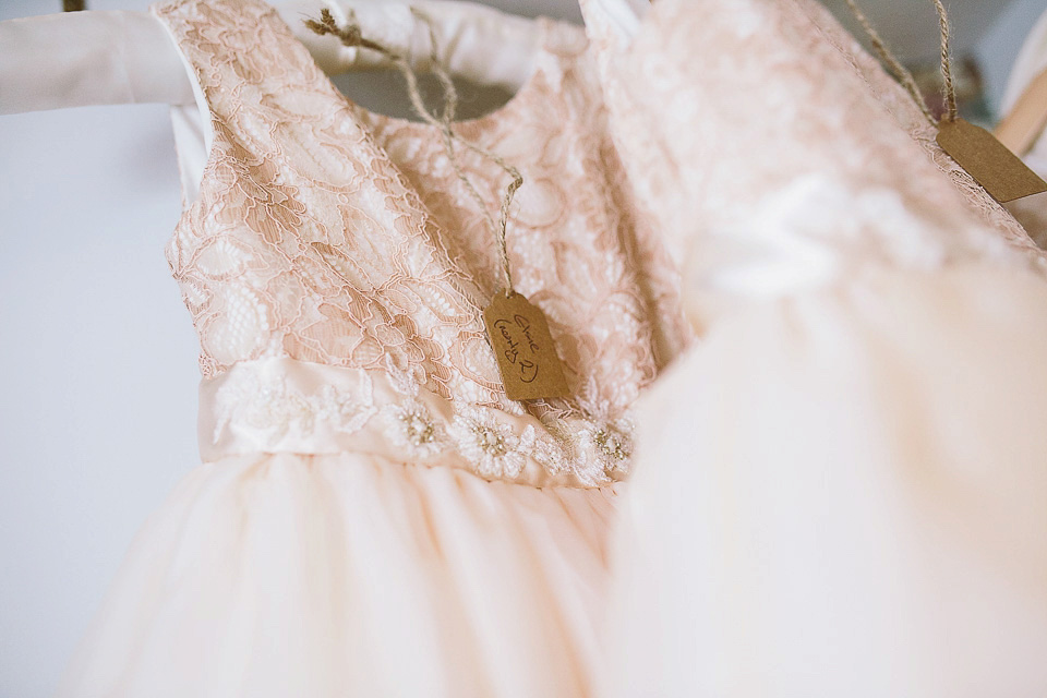 A blush pink wedding dress for a colourful and fun filled English country barn wedding. Photography by Jonny Draper.