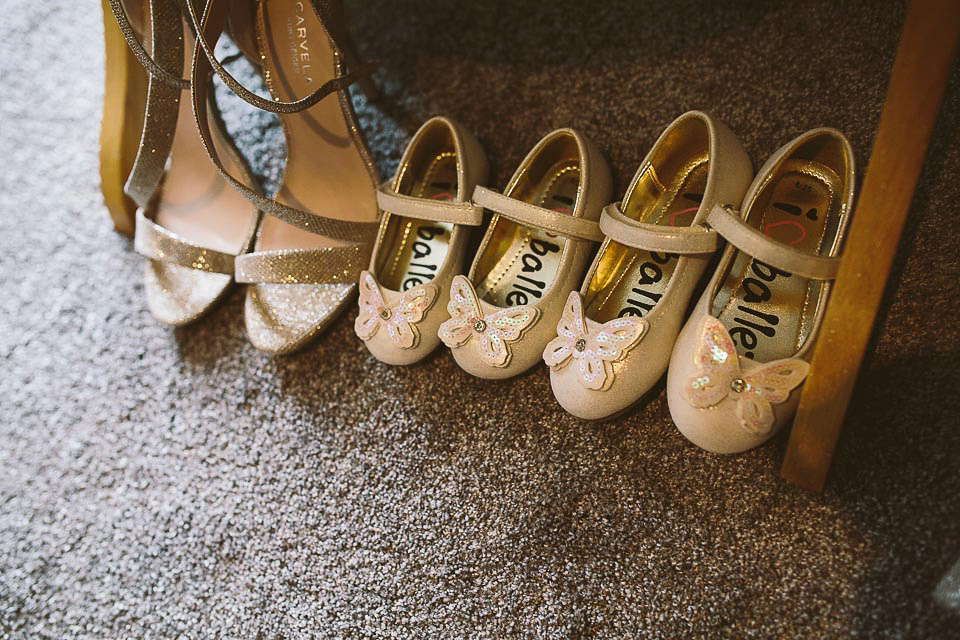 A blush pink wedding dress for a colourful and fun filled English country barn wedding. Photography by Jonny Draper.