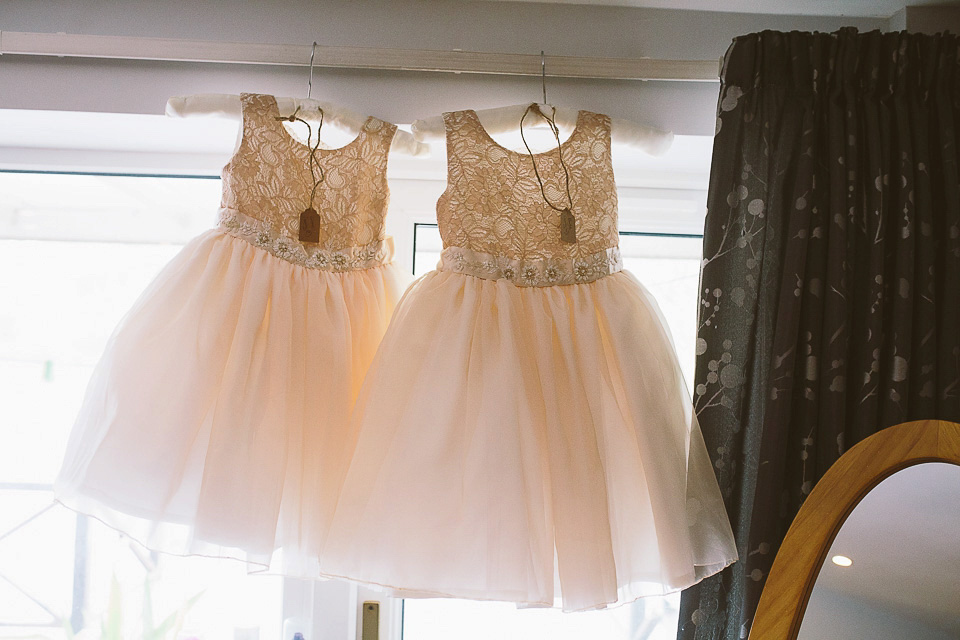 A blush pink wedding dress for a colourful and fun filled English country barn wedding. Photography by Jonny Draper.