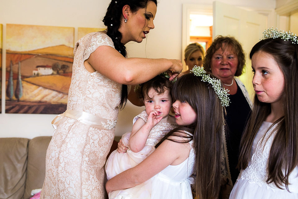 A blush pink wedding dress for a colourful and fun filled English country barn wedding. Photography by Jonny Draper.