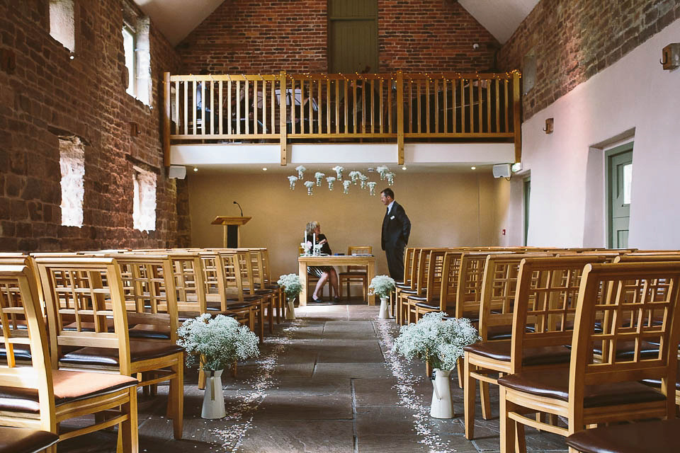 A blush pink wedding dress for a colourful and fun filled English country barn wedding. Photography by Jonny Draper.