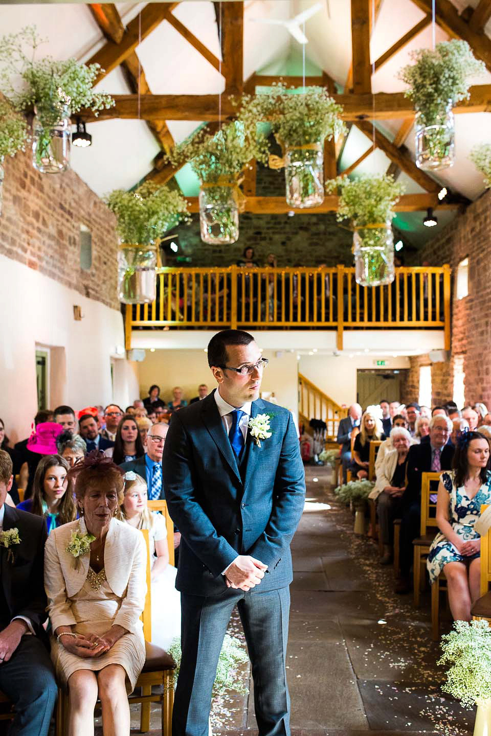 A blush pink wedding dress for a colourful and fun filled English country barn wedding. Photography by Jonny Draper.