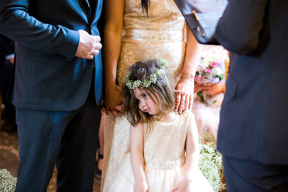 A blush pink wedding dress for a colourful and fun filled English country barn wedding. Photography by Jonny Draper.