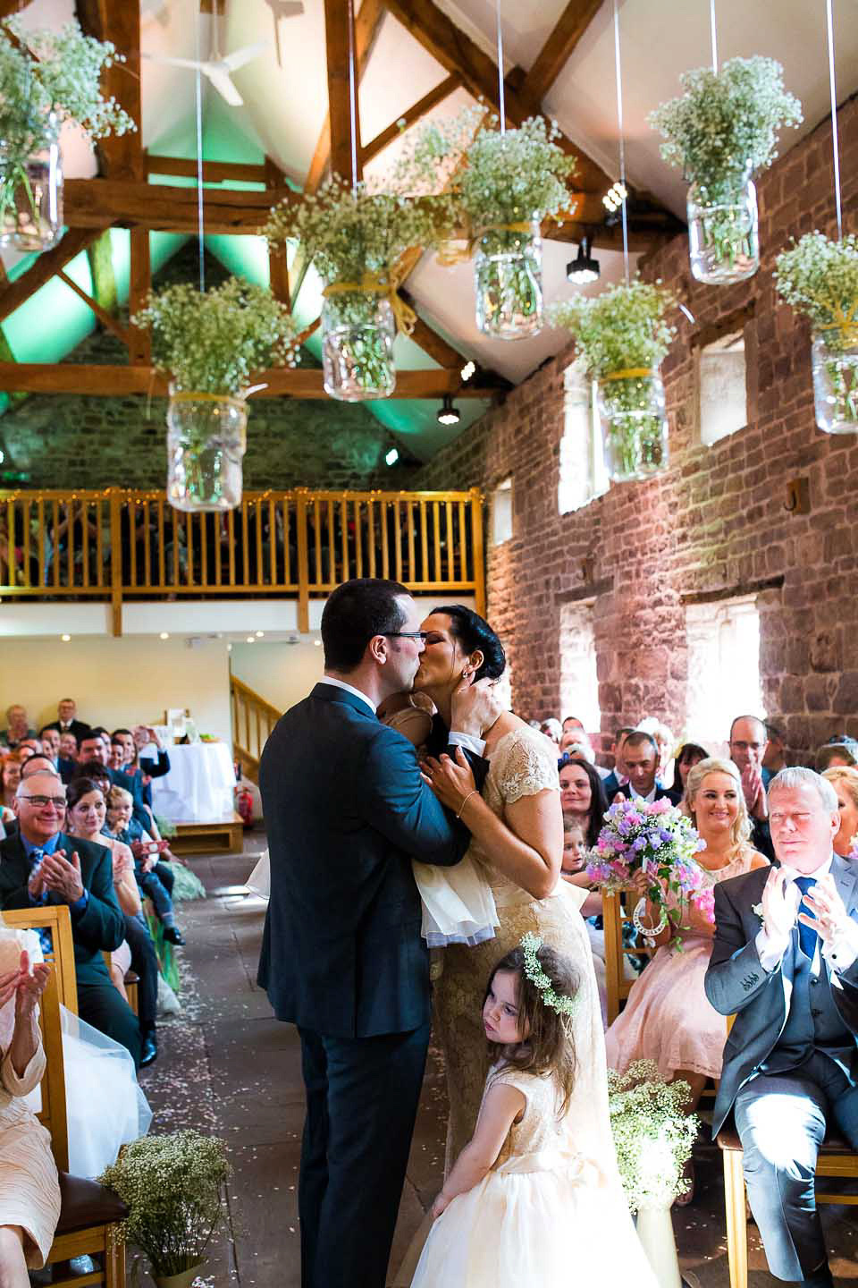 A blush pink wedding dress for a colourful and fun filled English country barn wedding. Photography by Jonny Draper.