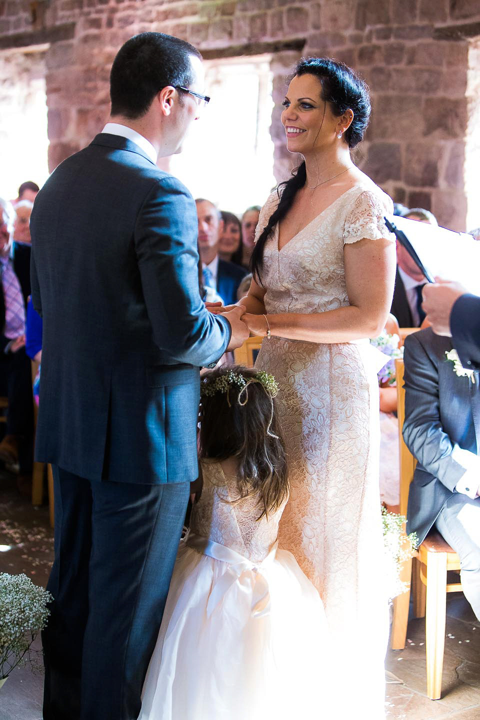 A blush pink wedding dress for a colourful and fun filled English country barn wedding. Photography by Jonny Draper.