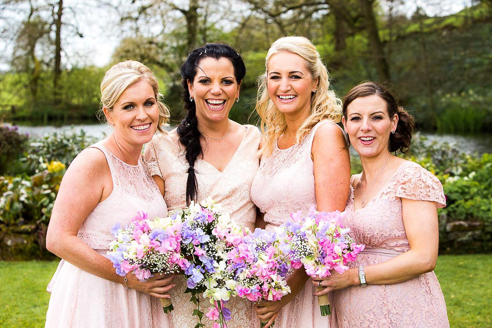 A blush pink wedding dress for a colourful and fun filled English country barn wedding. Photography by Jonny Draper.