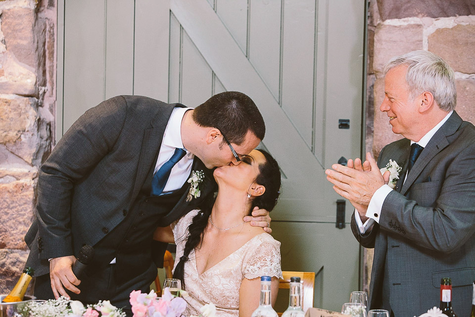 A blush pink wedding dress for a colourful and fun filled English country barn wedding. Photography by Jonny Draper.