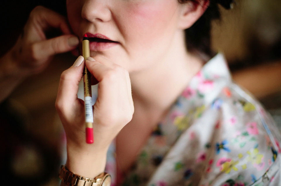 The bride wears Charlie Brear for her 'Railway Children' inspired yellow wedding. Photography by Claudia Rose Carter.