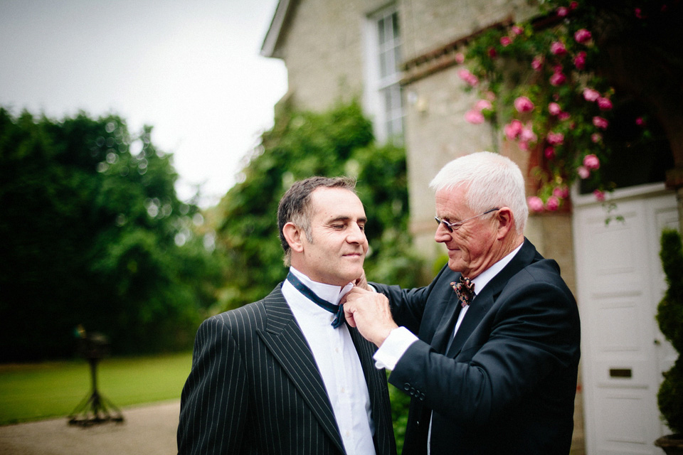 The bride wears Charlie Brear for her 'Railway Children' inspired yellow wedding. Photography by Claudia Rose Carter.