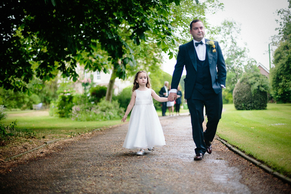 The bride wears Charlie Brear for her 'Railway Children' inspired yellow wedding. Photography by Claudia Rose Carter.