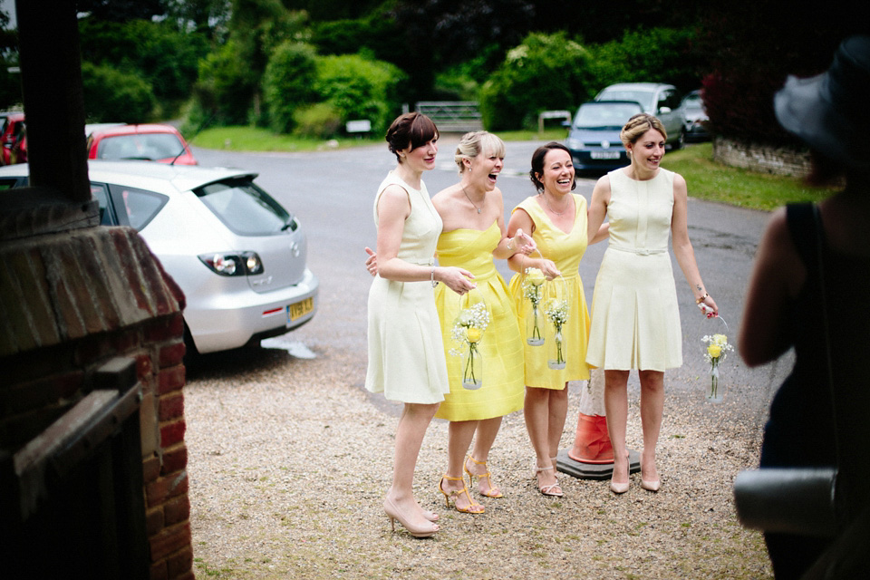 The bride wears Charlie Brear for her 'Railway Children' inspired yellow wedding. Photography by Claudia Rose Carter.