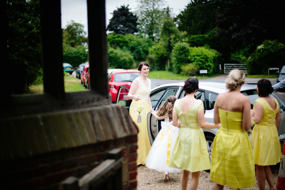 The bride wears Charlie Brear for her 'Railway Children' inspired yellow wedding. Photography by Claudia Rose Carter.
