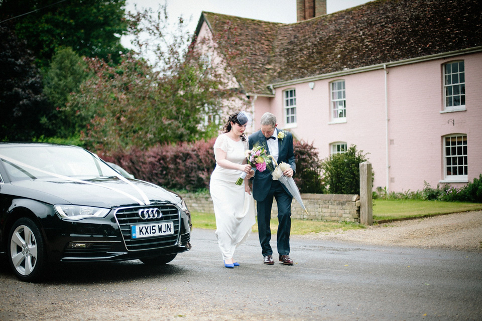 The bride wears Charlie Brear for her 'Railway Children' inspired yellow wedding. Photography by Claudia Rose Carter.