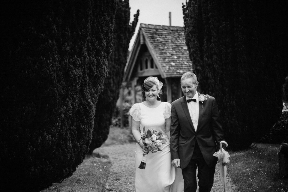 The bride wears Charlie Brear for her 'Railway Children' inspired yellow wedding. Photography by Claudia Rose Carter.