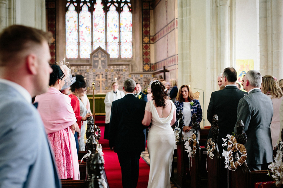 The bride wears Charlie Brear for her 'Railway Children' inspired yellow wedding. Photography by Claudia Rose Carter.