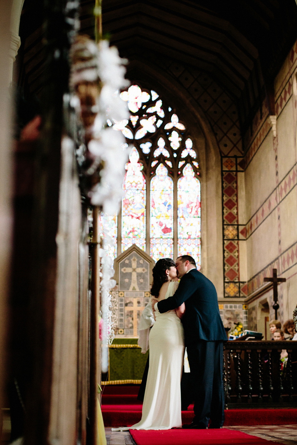 The bride wears Charlie Brear for her 'Railway Children' inspired yellow wedding. Photography by Claudia Rose Carter.