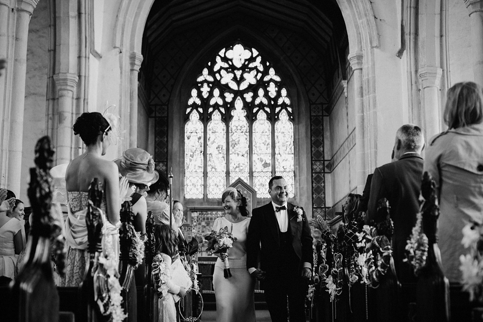 The bride wears Charlie Brear for her 'Railway Children' inspired yellow wedding. Photography by Claudia Rose Carter.