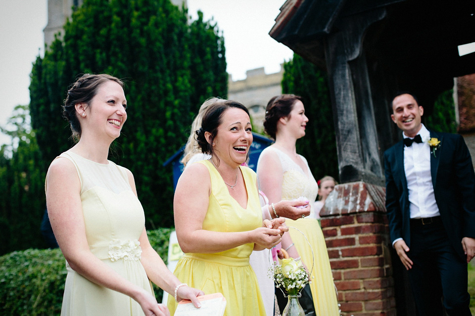 The bride wears Charlie Brear for her 'Railway Children' inspired yellow wedding. Photography by Claudia Rose Carter.