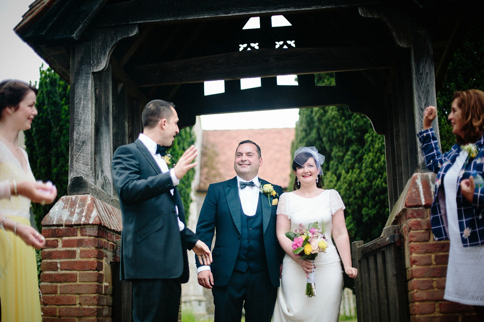 The bride wears Charlie Brear for her 'Railway Children' inspired yellow wedding. Photography by Claudia Rose Carter.