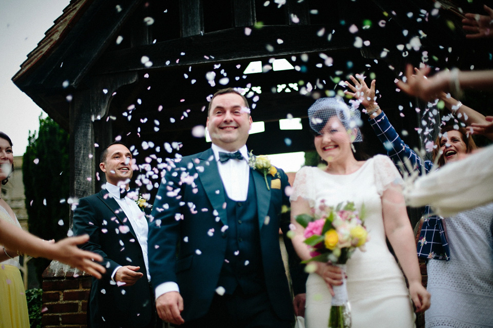 The bride wears Charlie Brear for her 'Railway Children' inspired yellow wedding. Photography by Claudia Rose Carter.