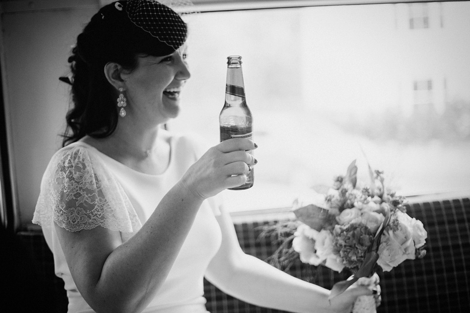 The bride wears Charlie Brear for her 'Railway Children' inspired yellow wedding. Photography by Claudia Rose Carter.